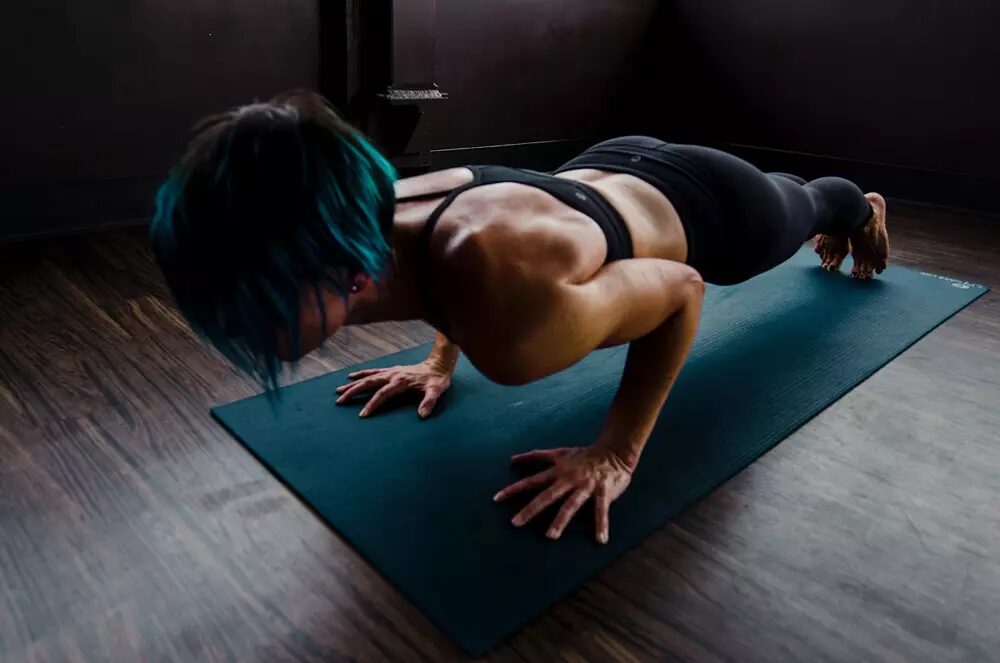 Woman exercises on EVA foam yoga mat