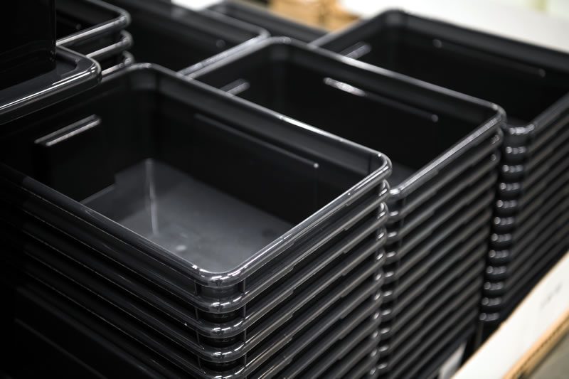 Stacked plastic bins.